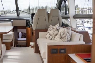Luxurious interior of 2018 Princess 49 yacht with elegant seating and decor.