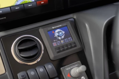 Control panel of a 2018 Princess 49 yacht featuring Seakeeper display and joystick.