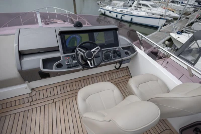 Helm of 2018 Princess 49 yacht with dual seats and navigation controls.