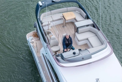 Aerial view of a 2018 Princess 49 yacht with a person at the helm.