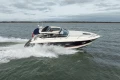 2013 Princess V39 yacht cruising on open water under cloudy skies.