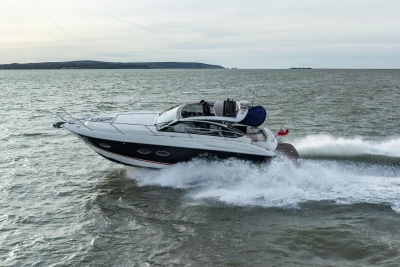 2013 Princess V39 yacht cruising on open water, showcasing sleek design and powerful performance.
