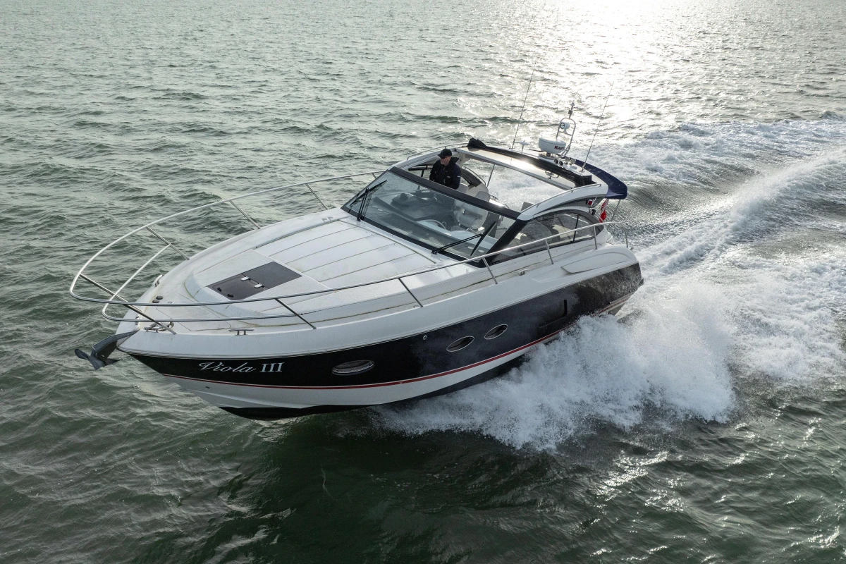 2013 Princess V39 yacht cruising on open water, showcasing sleek design and performance.