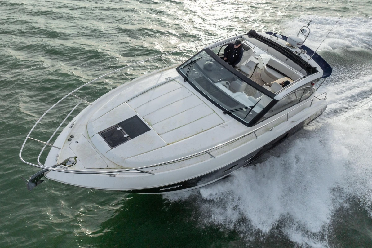2013 Princess V39 yacht cruising on open water, showcasing sleek design and luxury features.