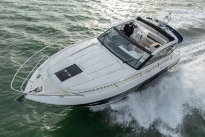 2013 Princess V39 yacht cruising on open water, showcasing sleek design and luxury features.