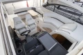 Luxurious 2013 Princess V39 yacht interior with plush seating and modern helm.