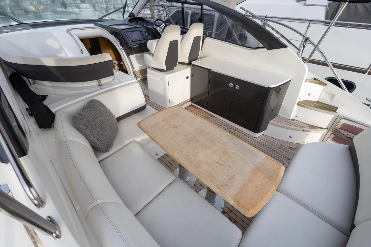 Luxurious 2013 Princess V39 yacht interior with seating and table.