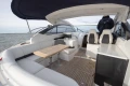 Luxurious 2013 Princess V39 yacht interior with seating and table on open water.