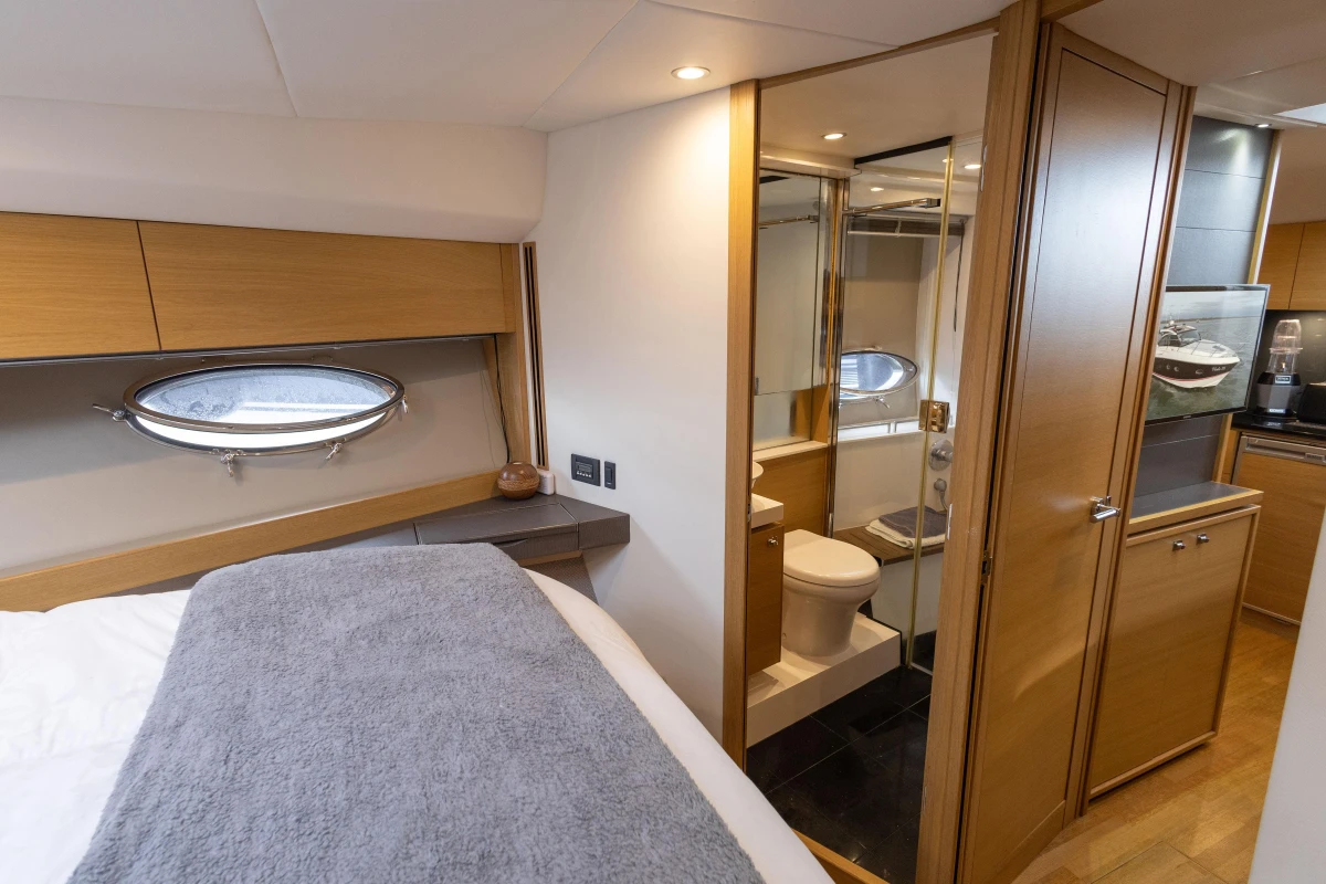 Luxurious 2013 Princess V39 yacht interior with bedroom, bathroom, and modern wood finishes.