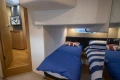 Cabin interior of 2013 Princess V39 yacht with twin beds and nautical decor.