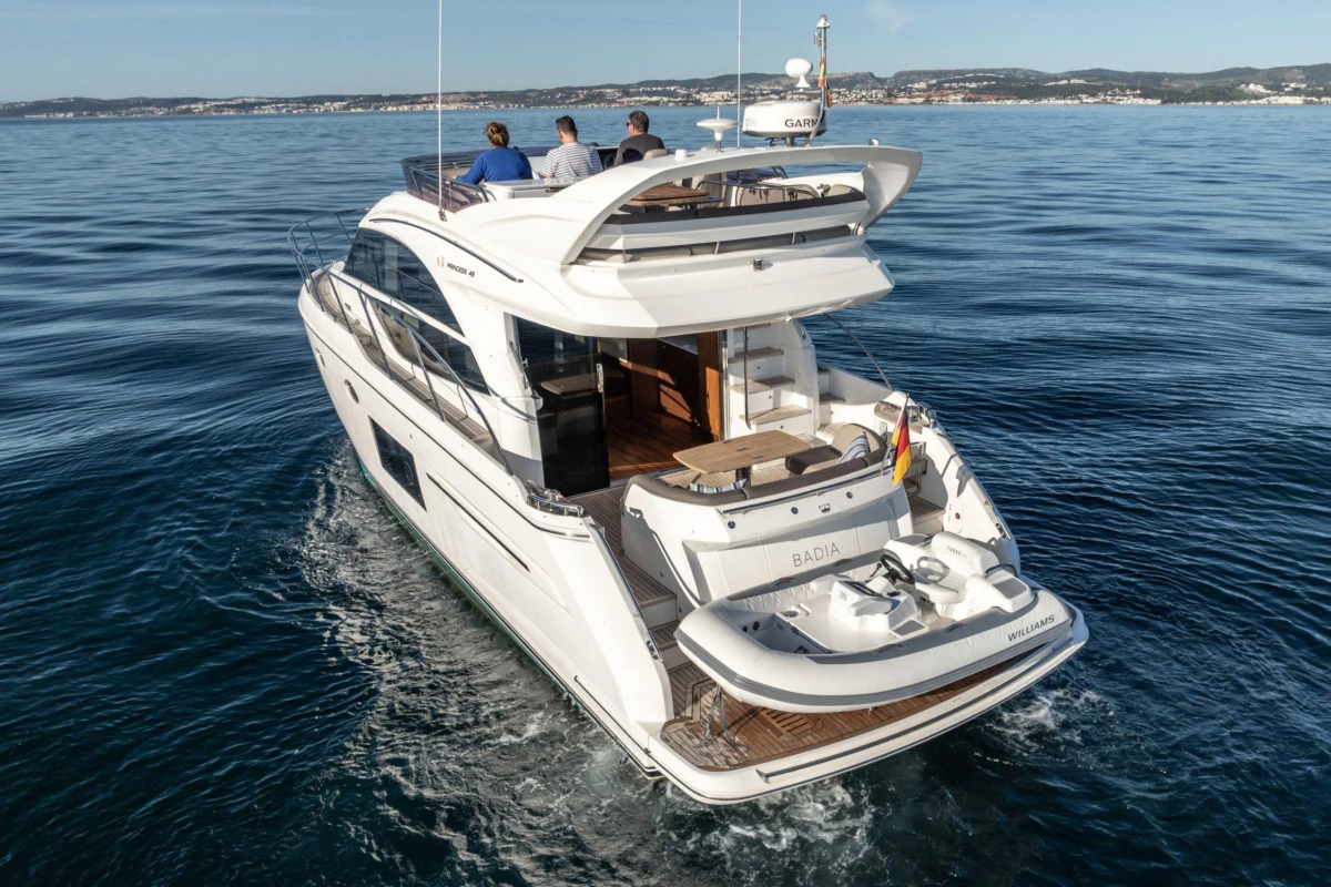 2017 Princess 49 yacht cruising on open water with passengers onboard.