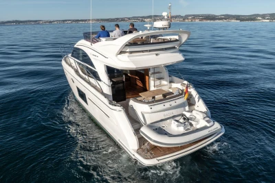 2017 Princess 49 yacht cruising on open water with passengers onboard.