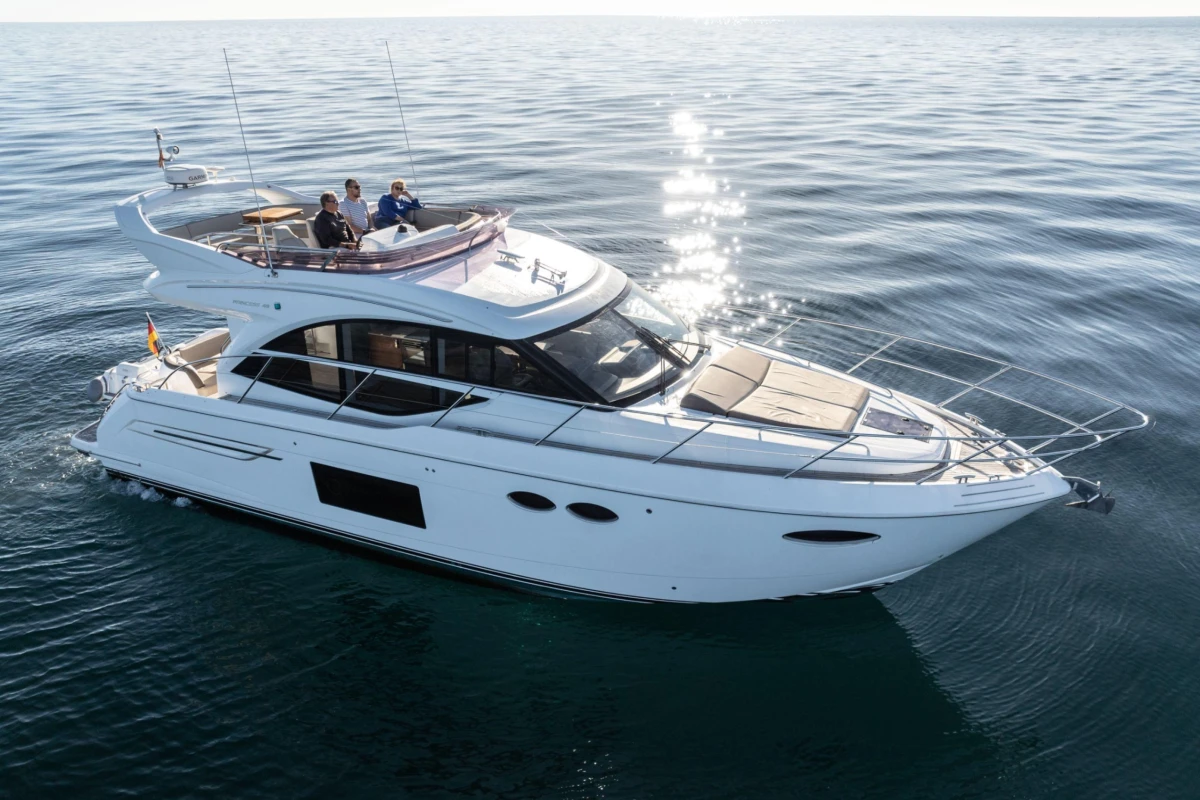 Luxurious 2017 Princess 49 yacht cruising on calm ocean waters.