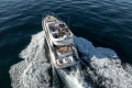 2017 Princess 49 yacht cruising on open water, aerial view.
