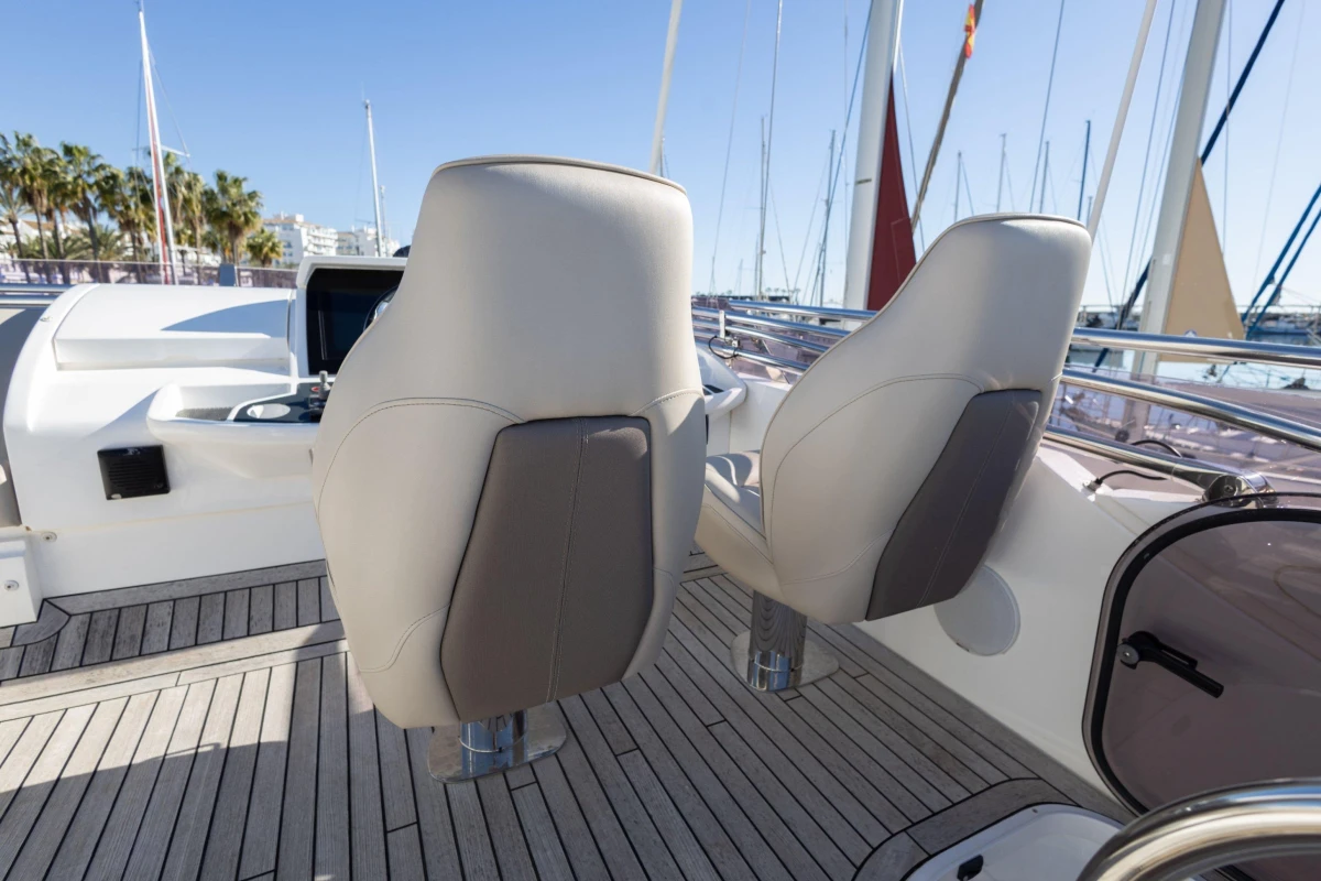 Luxury yacht Princess 49, 2017 model, featuring elegant helm seats and teak decking.