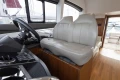 Interior of 2017 Princess 49 yacht with leather seating and steering wheel.
