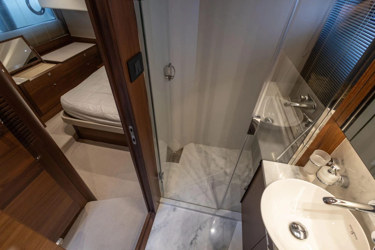 Luxurious 2017 Princess 49 yacht interior with elegant bathroom and cozy bedroom.