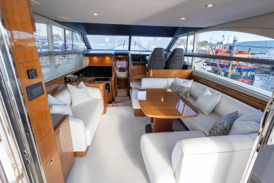 Luxurious interior of 2016 Princess 43 yacht with elegant seating and dining area.