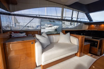 Luxurious interior of 2016 Princess 43 yacht with elegant seating and modern design.