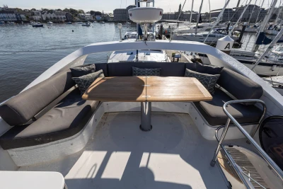 Luxurious seating area on 2016 Princess 43 yacht with waterfront view.