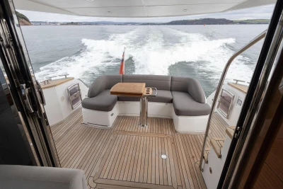 Luxury Princess 43 yacht interior with teak deck, cruising on open water, 2016 model.