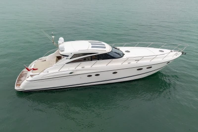 2009 Princess V58 yacht cruising on calm waters, side view.