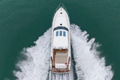 Aerial view of 2009 Princess V58 yacht cruising on open water.