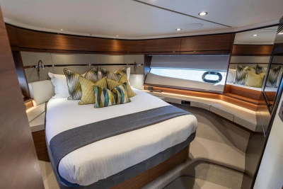 Luxurious 2022 Princess S66 yacht bedroom with elegant decor and modern design.