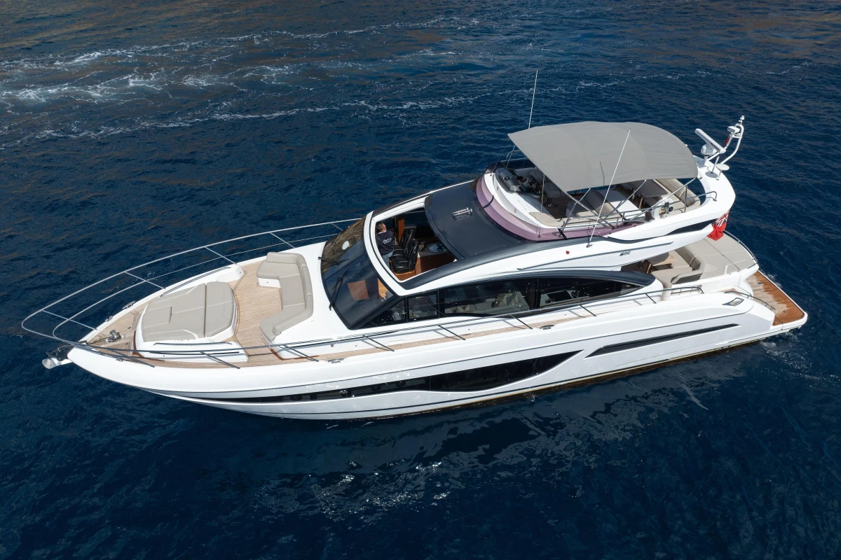 Luxury 2022 Princess S66 yacht cruising on open blue sea.