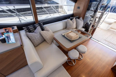 Luxurious interior of 2022 Princess S66 yacht with elegant seating and decor.