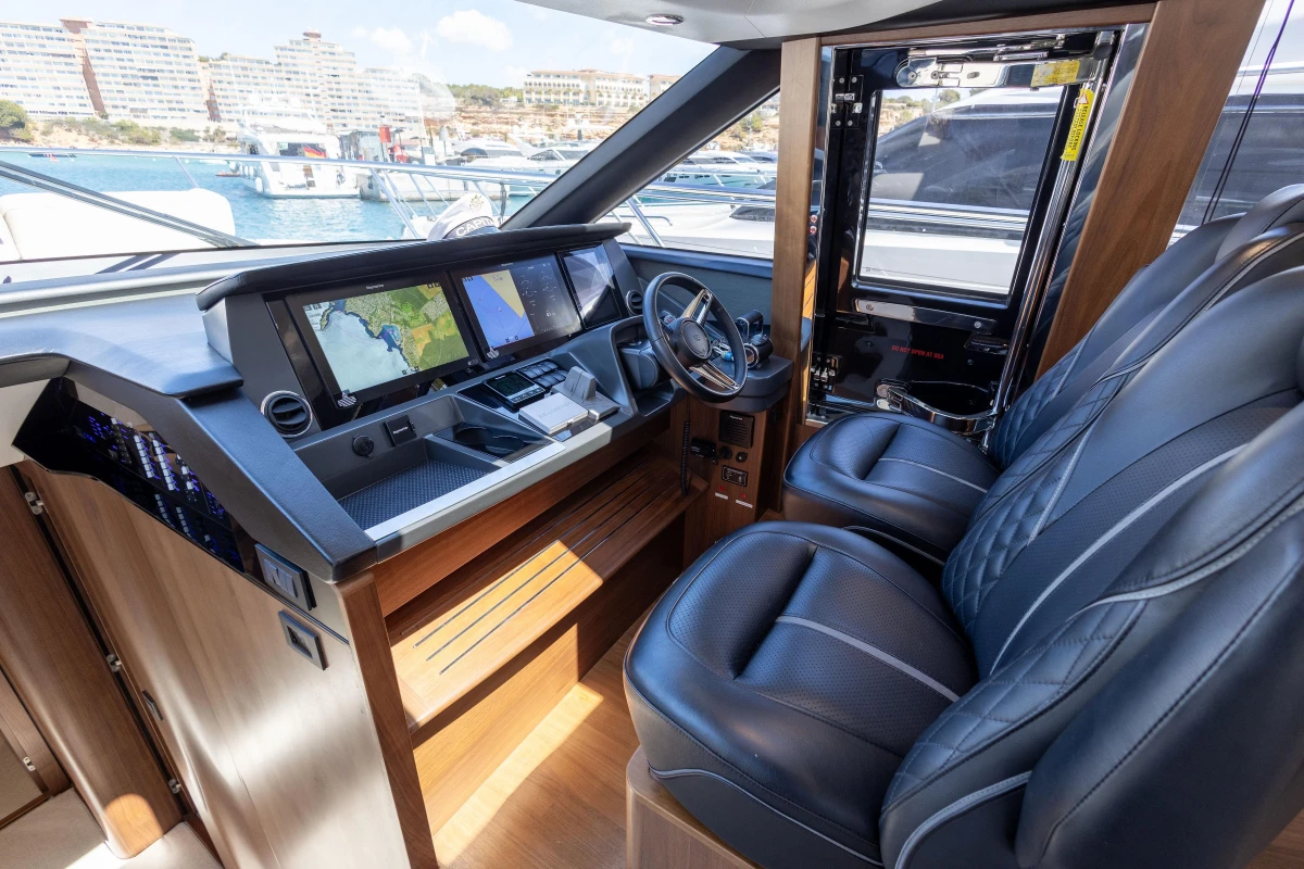 Luxurious 2022 Princess S66 yacht cockpit with advanced navigation systems and plush seating.