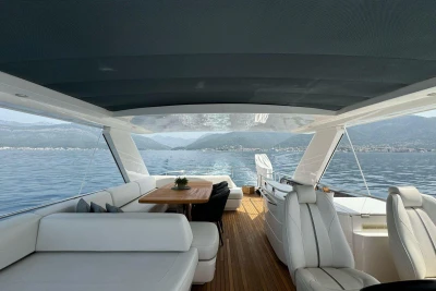 Luxurious 2022 Princess S66 yacht interior with elegant seating and scenic ocean view.