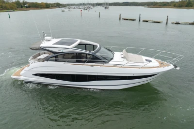 2022 Princess V50 yacht cruising on calm waters, showcasing sleek design and luxury features.