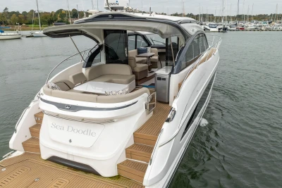 Luxury 2022 Princess V50 yacht docked, featuring sleek design and spacious deck.