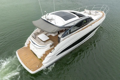 2022 Princess V50 yacht cruising on water, featuring sleek design and spacious deck.