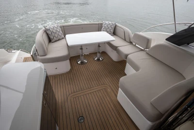 Luxurious 2022 Princess V50 yacht deck with elegant seating and table setup.