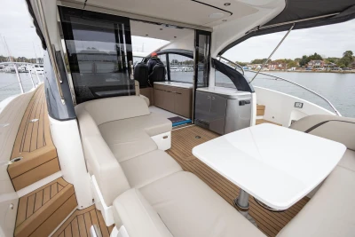 Luxurious 2022 Princess V50 yacht interior with elegant seating and dining area.