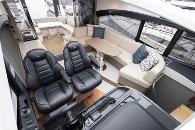 Luxurious interior of 2022 Princess V50 yacht with leather seating and modern design.