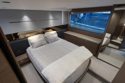 Luxurious bedroom interior of 2022 Princess V50 yacht with modern design and elegant furnishings.