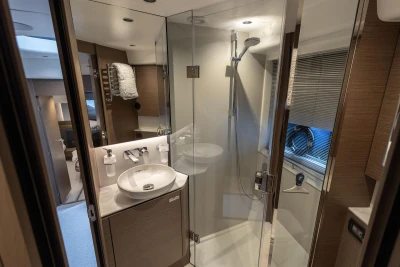 Luxurious 2022 Princess V50 yacht bathroom with modern shower and sleek design.