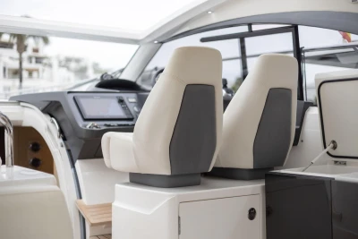 Interior of 2016 Princess V39 yacht with modern helm and dual seats.