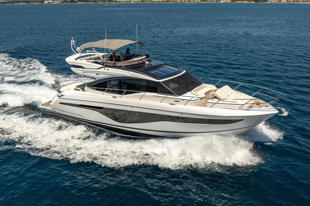 2023 Princess S62 yacht cruising on open water, showcasing sleek design and luxury features.