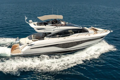 2023 Princess S62 yacht cruising on open sea, showcasing sleek design and luxury features.
