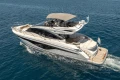 2023 Princess S62 yacht cruising on open water, showcasing sleek design and luxury features.