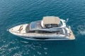 Luxurious 2023 Princess S62 yacht cruising on clear blue waters.