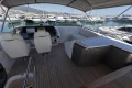 Luxurious 2023 Princess S62 yacht interior with elegant seating and marina view.