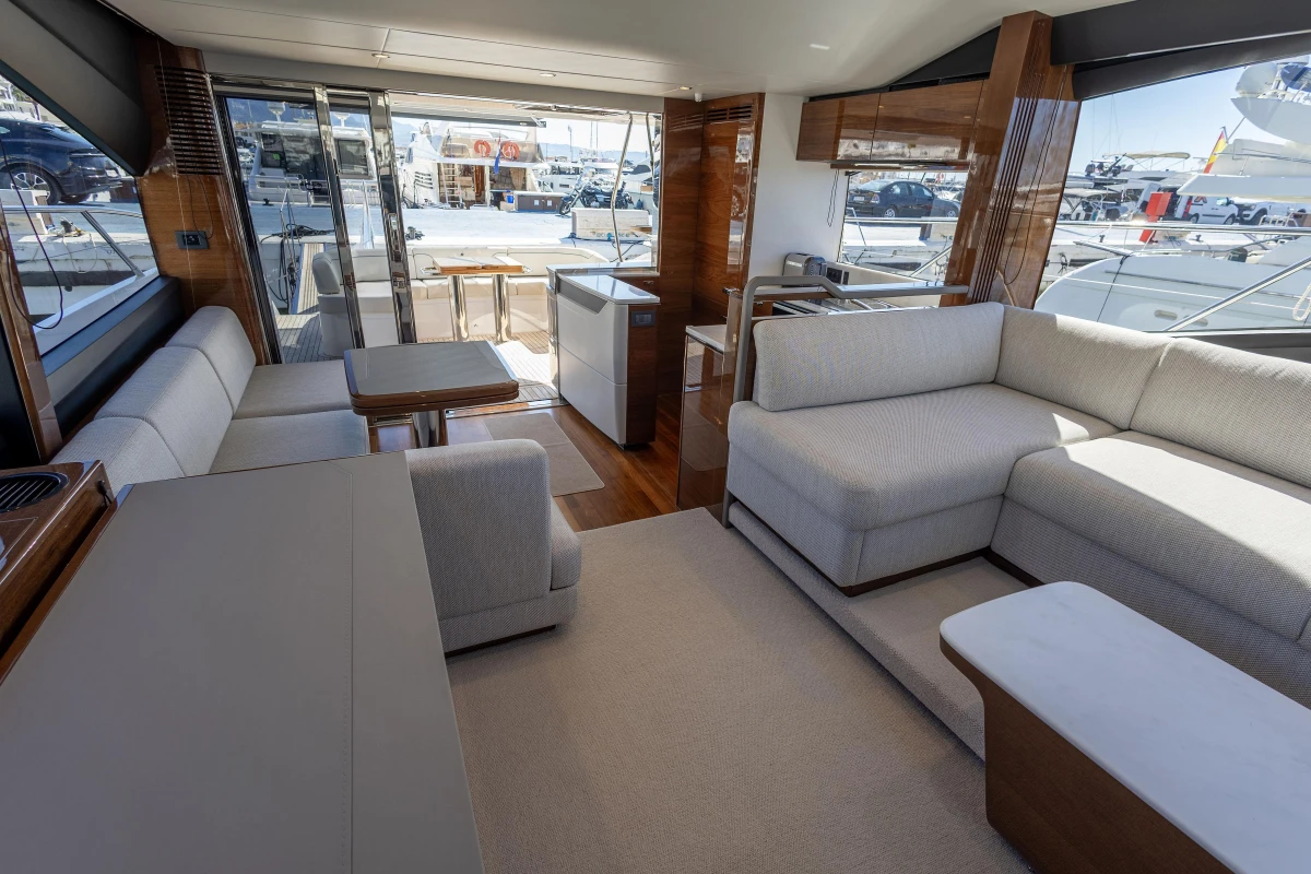 Luxurious interior of 2023 Princess S62 yacht with modern seating and elegant design.