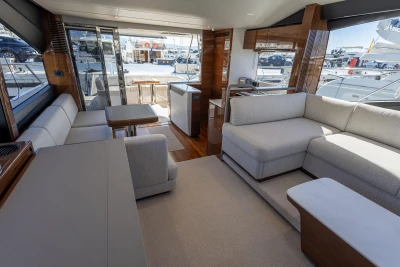 Luxurious interior of 2023 Princess S62 yacht with modern seating and elegant design.
