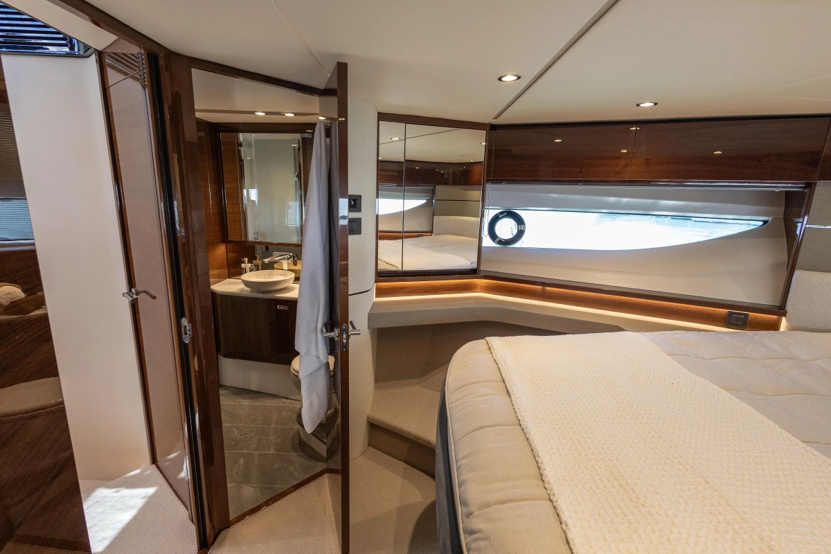 Luxurious 2023 Princess S62 yacht interior with elegant bedroom and ensuite bathroom.