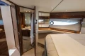 Luxurious 2023 Princess S62 yacht interior with elegant bedroom and ensuite bathroom.